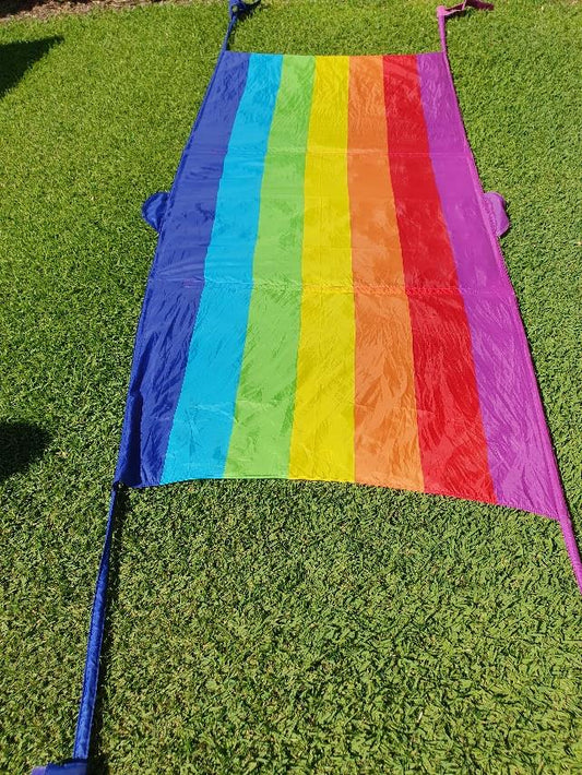 Huge velcro tie RAINBOW ARCH.  Ties to 4 legs of table.