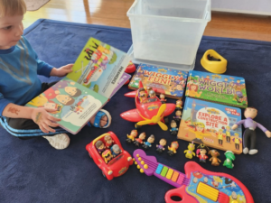 wiggles free books figurines wiggle tunes guitar big red car big red plane x2 song phones lachy doll with bottle x2 emma cushions lachy baby doll potty.webp